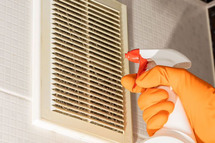 air vent cleaning by a professional pest control worker