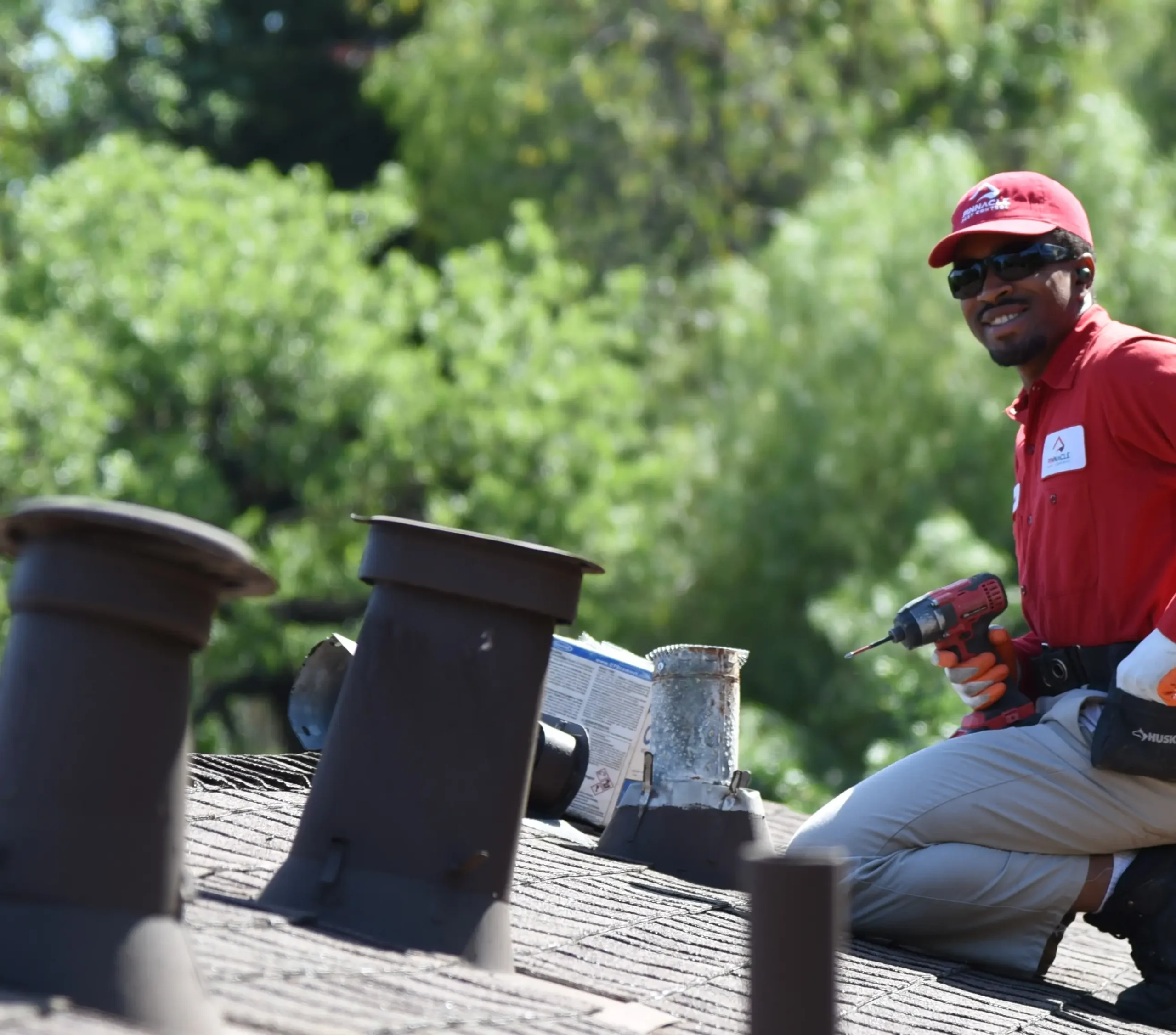 Pinnacle Pest Control technician performing roof rat exclusion in attic — rat exterminator service in Sacramento, CA